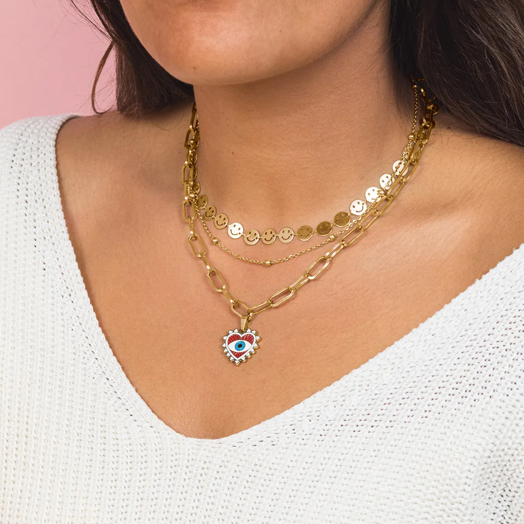 Gold coloured necklace with evil eye charm